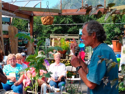 Gardening guru Ciscoe Morris speaks to a crowd of more than 150 people during a recent visit to Freeland Ace.