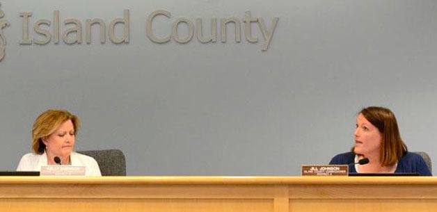 Island County Commissioner Kelly Emerson reacts to comments by Commissioner Jill Johnson Monday. Emerson was reproached by her colleagues for taking action that contradicted a decision by the majority of the board.