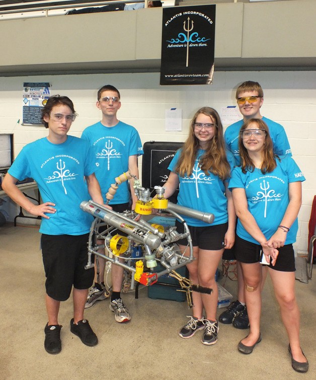 Whidbey Island’s underwater robotics team poses for a picture at the international competition this summer at the Weyerhaeuser King County Aquatic Center in Federal Way. From left to right are Derrick Riley