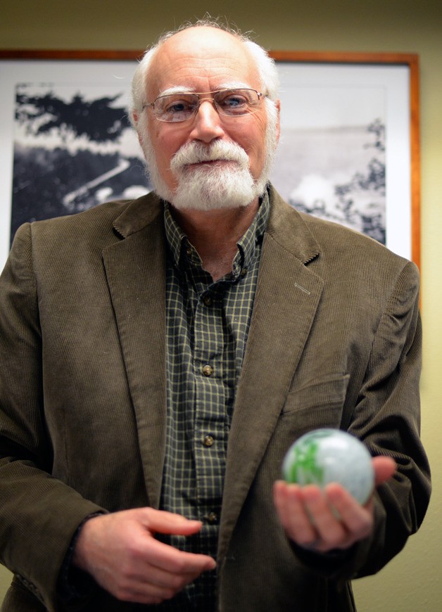 Langley Councilman Hal Seligson holds up a piece of blown-glass that was presented to him by Mayor Fred McCarthy during Monday’s council meeting for his years of service to the city. Appointed to fill a vacancy in 2010