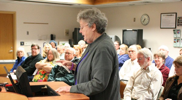 Retired nurse Barbara Read recites a recent letter to the editor at Monday’s hospital board meeting. In her letter