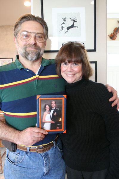 Freeland residents John and Chelle Brunke pose with a picture of their son