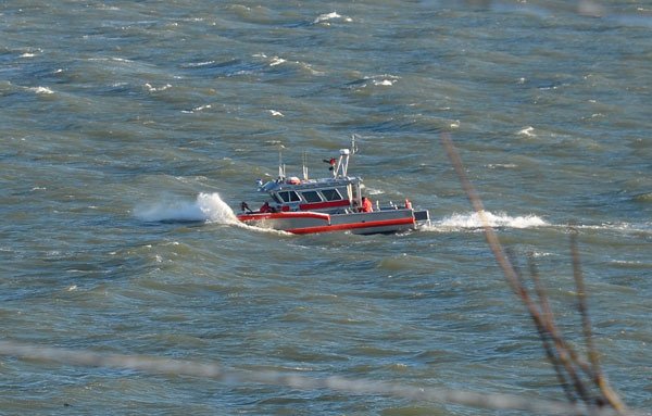 South Whidbey Fire/EMS responders charge through choppy water off of Langley’s shores during a December 2014 snowstorm.