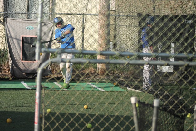 Falcon sophomore Will Simms slaps a shot during batting practice earlier this season. He is slated to play outfield and pitch.