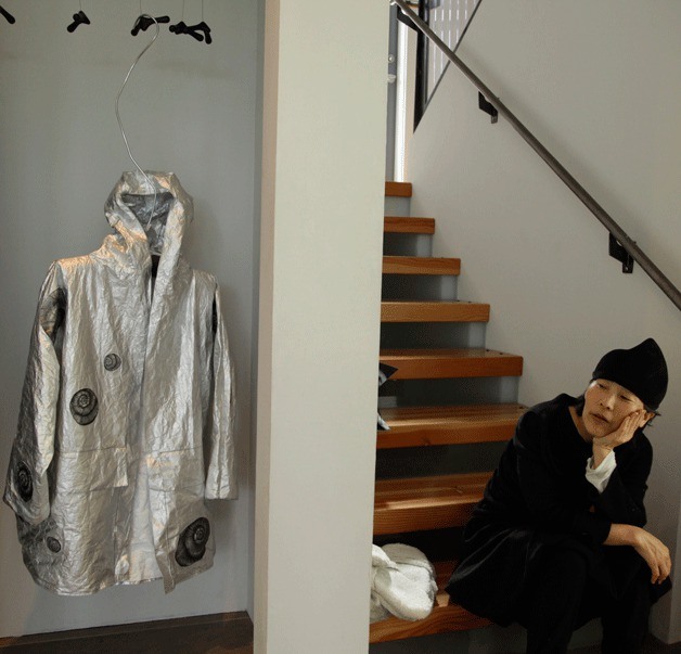 Lynn Mizono contemplates the Raindot Coat she made with Danielle Bodine for the next MUSEO show