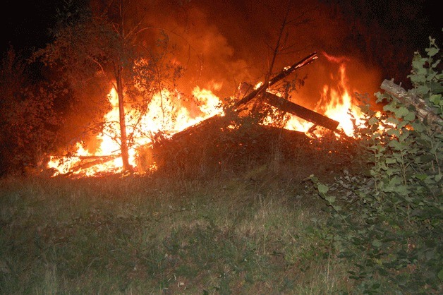 An abandoned home burns in Clinton on Monday night. The fire was intentionally set twice