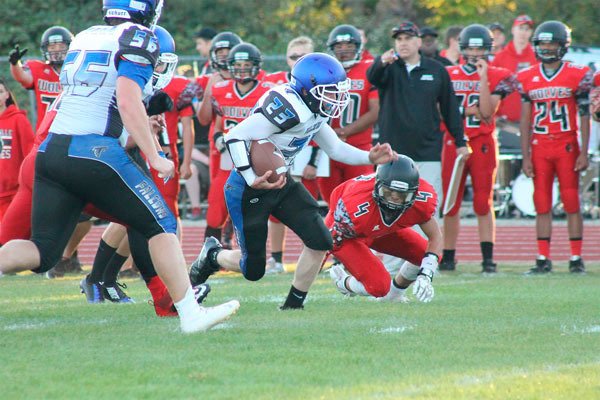 South Whidbey senior running back Hunter Newman runs for a first down against Coupeville on Sept. 3. The Falcons forfeited their game against Archbishop Murphy on Friday night.
