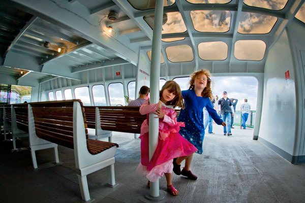 David Welton photo Kayla and Araya Johnson play on the viewing deck of a Washington State ferry this past fall. The image was taken by Clinton resident David Welton and earned him first place at the Edmonds Arts Festival.