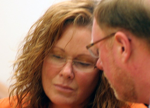 Peggy Sue Thomas listens to advice from attorney Craig Platt during a court hearing in 2012. Thomas faces her sentencing for involvement in the 2003 murder of Russel Douglas.