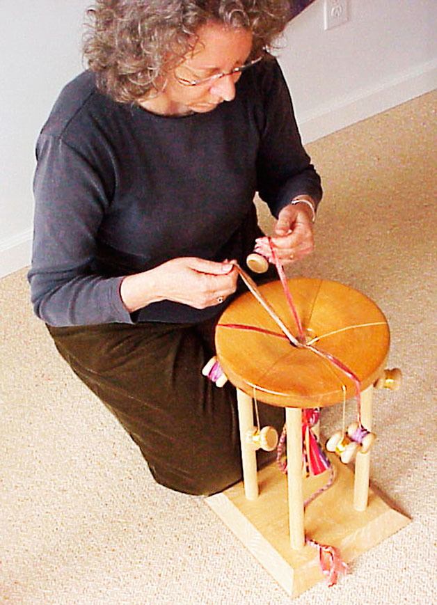 Janis Saunders of Stonepath Textile Studio works in the Japanese kumihimo method on a marudai to create her unique braided jewelry. Saunders is studio number 29 on the Whidbey Open Studio Tour 10 a.m. to 5 p.m. Saturday