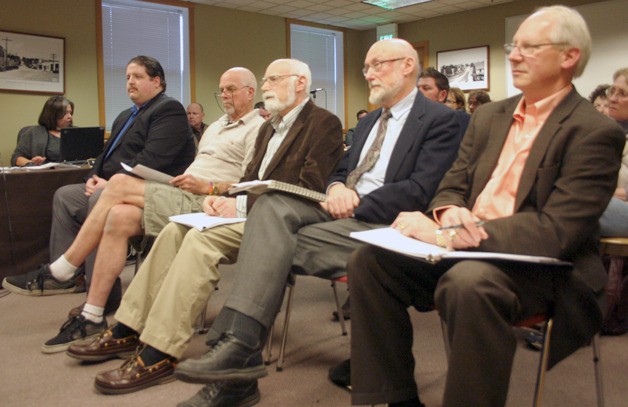 Candidates to be Langley’s appointed interim mayor await interview questions at the city council meeting Tuesday. From left are Thomas Gill