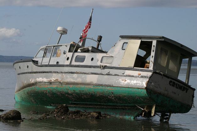 This 50-foot vessel was left on the rocky beach north of Double Bluff in Freeland in late March. Responding to derelict vessels like this will have added laws after Gov. Jay Inslee signed a bill this week.
