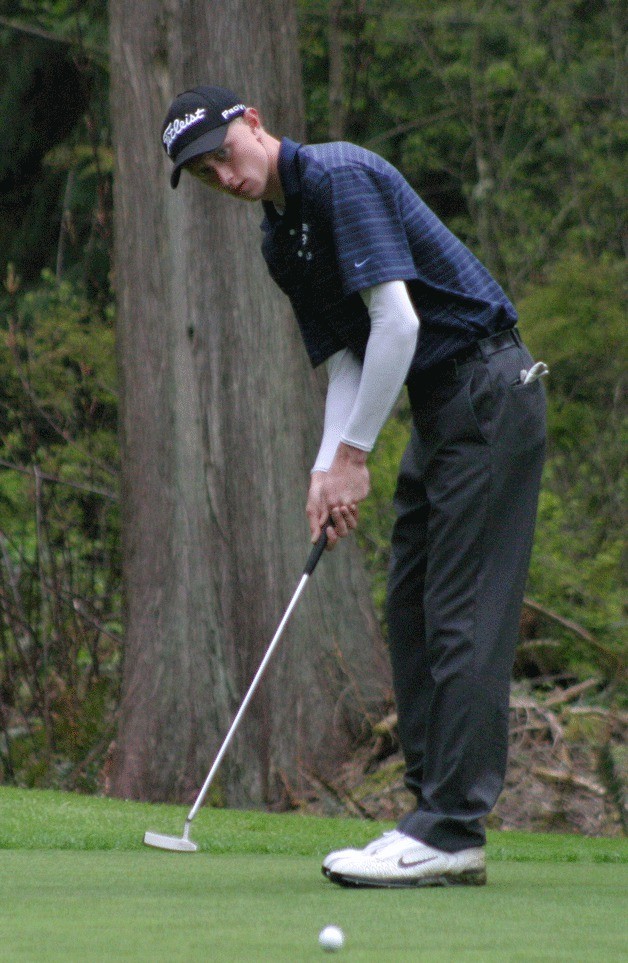 Harrison Price putts on the 12th hole at Snohomish Golf Course. Price shot a 71 and won the conference tourney.