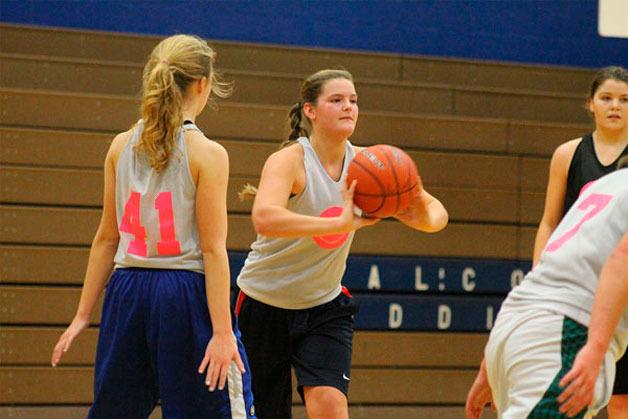Junior Kinsey Eager passes the ball during team drills at South Whidbey High School while preparing for the season opener at Coupeville on Dec. 2.