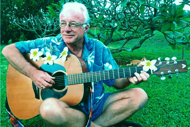 Derek Parrott plays his guitar in Kuaui