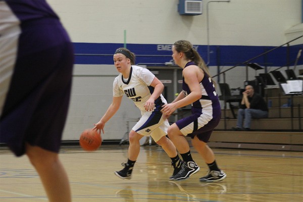 South Whidbey sophomore Mikayla Hezel dribbles the ball with Nooksack Valley’s Olivia Berkan defending. The Falcons lost 54-45 in overtime to the Pioneers and will play in a loser-out game on Feb. 11 on the road.