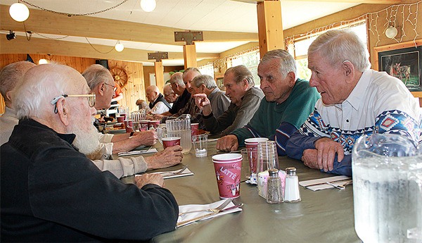 Dean Campbell (left) talks with Don Goodfellow and Albert Luhn on Thursday afternoon. The three are part of a group of 15 men who graduated from Langley High School in the 1940s and early 1950s.  Langley High School was located on the same property as the present-day Langley Middle School. The men meet for lunch at noon on the second Thursday of each month at the Holmes Harbor Rod and Gun Club.