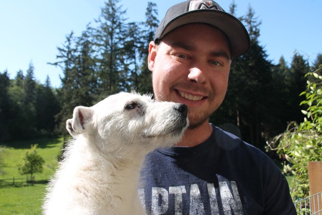 Ben Brager and his dog take in the sunshine briefly at his family’s Freeland home. The 24-year-old has two autoimmune diseases and is in need of a kidney transplant.