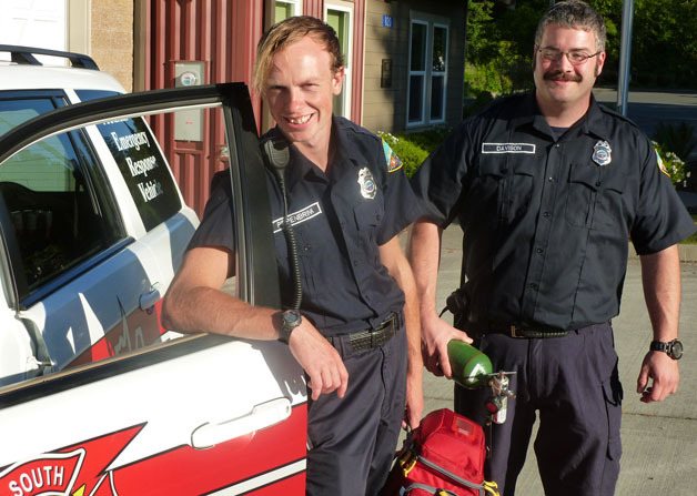 Will Piepenbrink and Brent Davison take in their new environment at a fire station after they were inducted as emergency medical technicians with South Whidbey Fire/EMS.