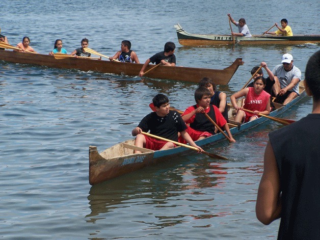 Canoe paddlers race at a previous Penn Cove Water Festival.