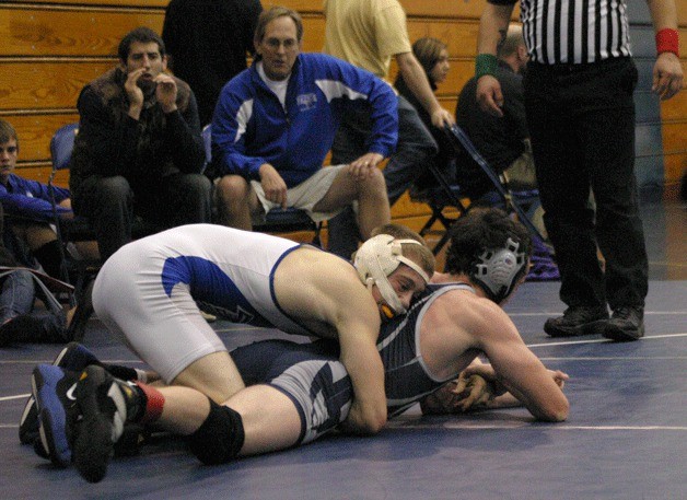 Evan Thompson tries to keep Squalicum’s Nick Foldenhauer down during the Everett Classic wrestling tournament. Thompson advanced to the final match in the 145-pound division
