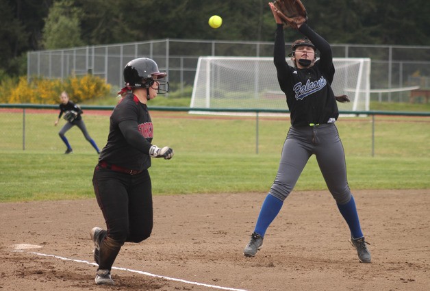 A line drive shoots past Falcon third baseman Kacie Hanson in a Cascade Conference fastpitch softball game against Cedarcrest on May 1.