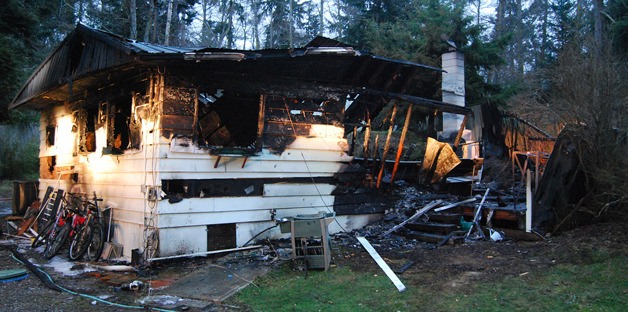 A Smugglers Cove Road home lies in ruin after being destroyed by an early morning fire Jan. 4. A man and a cat were in the house and escaped.