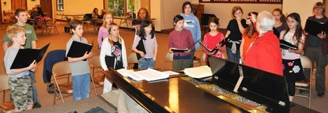 Some South Whidbey Honor Choir students work with director Carol Foster to prepare for the choir ‘s banner performance at Benaroya Hall with the Everett Youth Symphony Orchestra on May 16.
