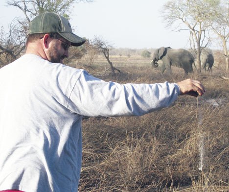 David Reeves sprinkles the ashes of former South Whidbey teacher and track coach Carl Westling at Pendjari Game Park in the African country of Benin