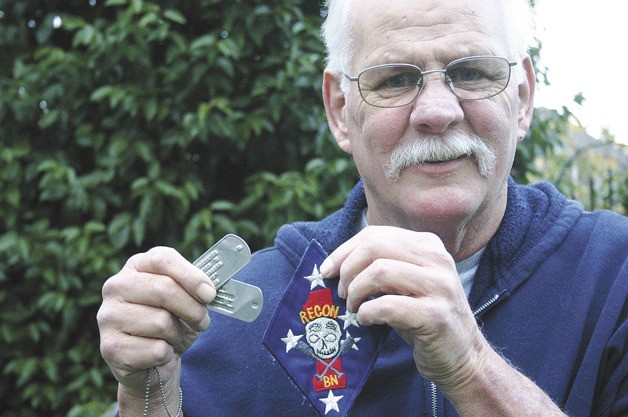 Vietnam veteran Gary Nau shows his Marine Corps dog tags and reconnaissance unit patch: “I can’t stop the wars