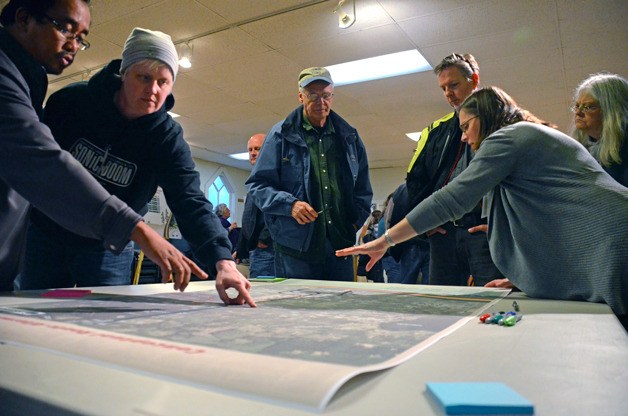 Island County Public Works Engineer Joe Araucto and Crawford Road land owner Ferris Dudunake