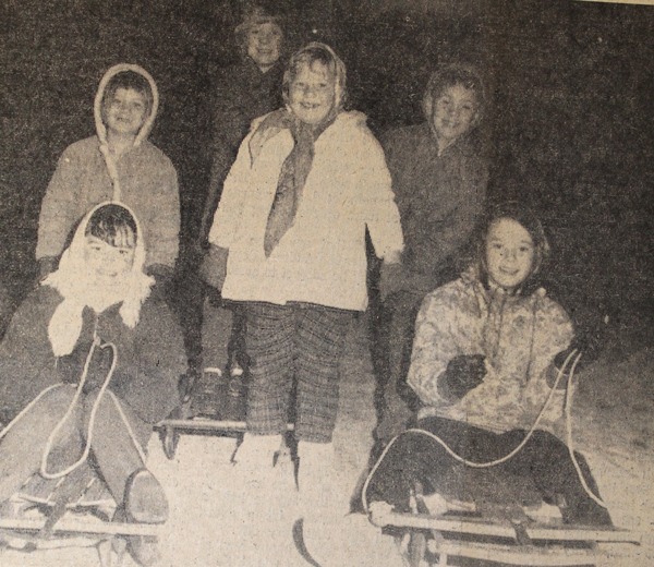Sledders — Typical scene in the past two days in this group of young sledders pictured after sliding down First Street in Langley