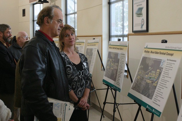 Robin Adams of Langley looks over proposals for the future of the Mukilteo Ferry Terminal on Tuesday night