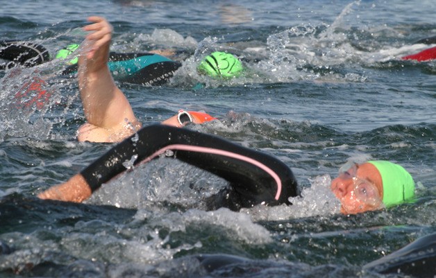 Swimmers thrash toward the first buoy of the Whidbey Adventure Swim on Sept. 8 in Langley.