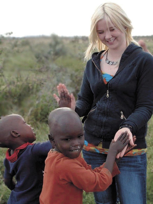 Kate Nilsen of Langley with Maasai children in Kenya during her two-week visit to teach basic computing.