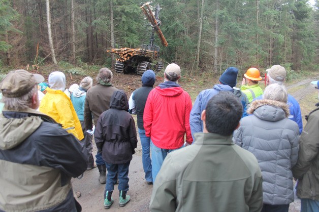 A group of visitors get a tour of the tree thinning operation at Trillium Woods in Freeland on Dec. 19. Janicki Logging and Construction was clearing a third of the trees from a 130-acre section of the 654-acre nature conservancy.