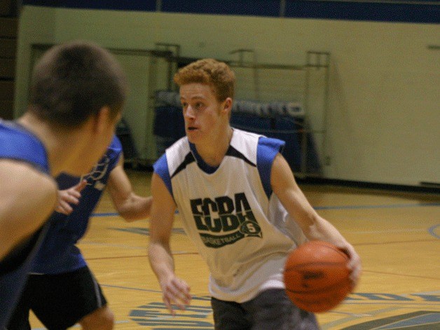 Sam Turpin drives against the junior varsity team during a recent practice. The junior guard and the other Falcon athletes resumed practices this week.