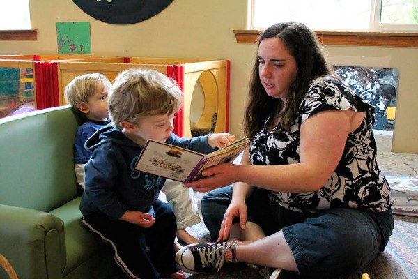 A child is read to during a lesson at South Whidbey Children’s Center in Langley.