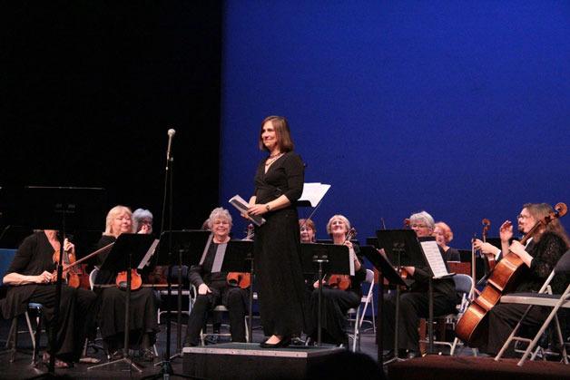 Island County Commissioner Helen Price Johnson takes a bow at the Saratoga Chamber Orchestra’s May 6 Gala Concert with musical guests Alasdair Fraser and Natalie Haas at South Whidbey High School Auditorium.