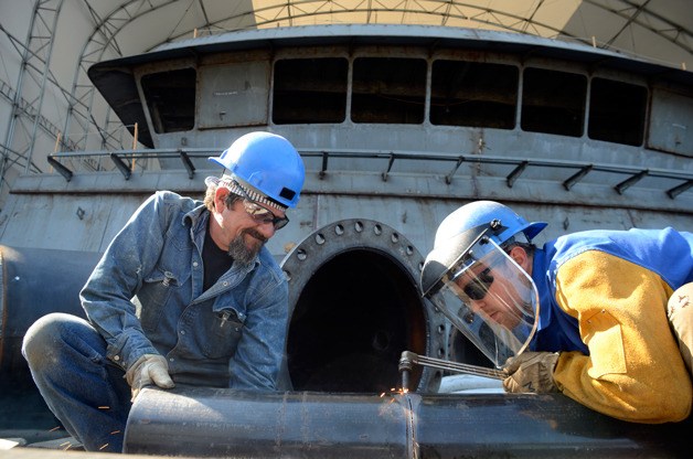 Tim Neraf assists Michael Christensen