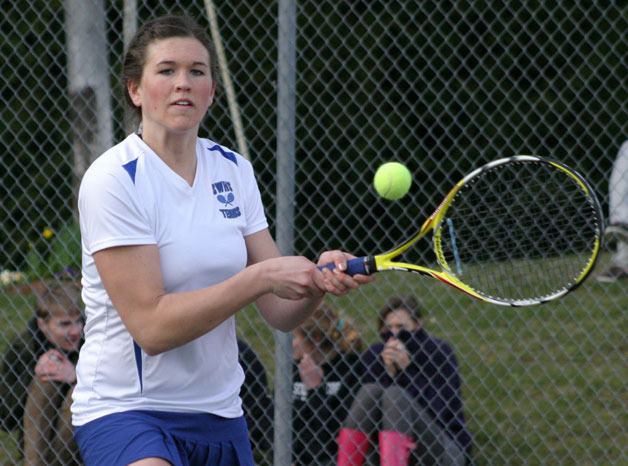 Jessica Cary returns a backhand during an earlier match against Overlake at South Whidbey High School. The senior and her first doubles partner Amelia Weeks won both road matches last week.