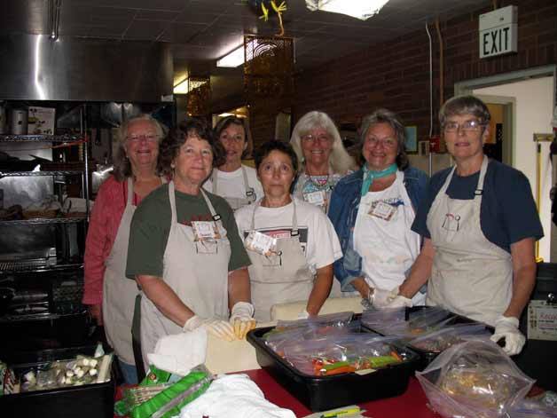 Wednesday WIN volunteers do prep work for the family bags