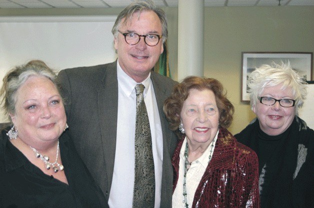 Virginia LaRue smiles with daughters Michele (left) and Denise (right) as the Langley City Council last year saluted her contributions to the business community. With them is Mayor Paul Samuelson.