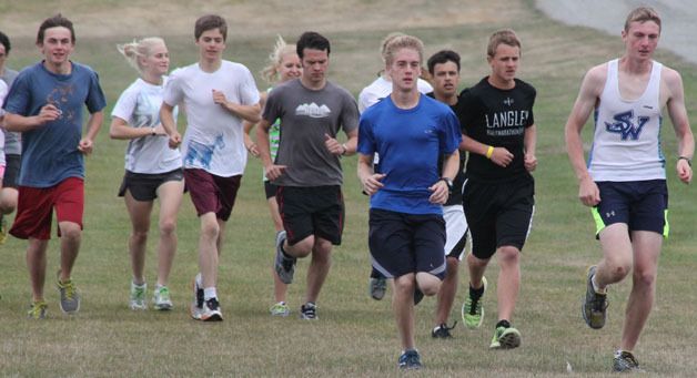 South Whidbey’s cross country teams head out for a run at Camp Casey in Coupeville at the start of the season. Leading the pack are Gavin Imes