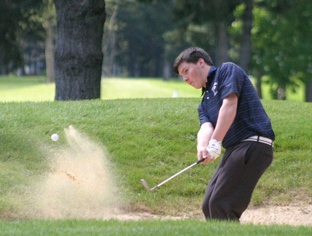Jesse Portillo wedges out of the bunker on the 15th hole. Portillo could be called “The Sandman” with how often he hit into