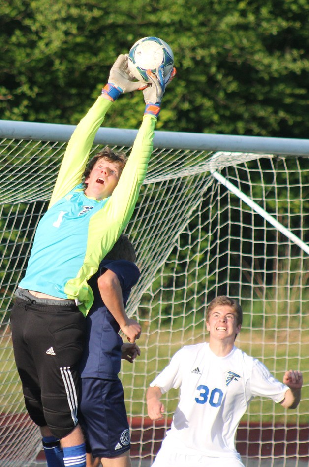 Falcon goalie Charley Stelling leaps to catch a corner kick against Cascade Christian on May 13 at Kamiak High School.