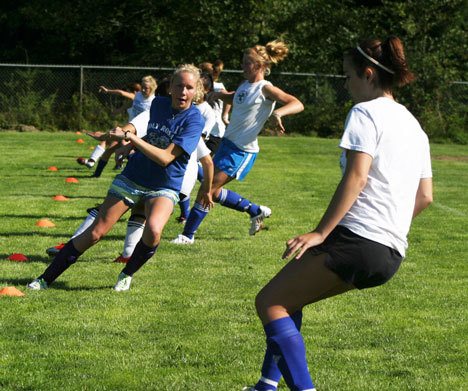 Jessica Manca and the rest of the Falcon girls soccer team engage in a 300-yard timed run on the first day of practice.
