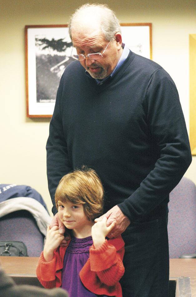 Langley Mayor Larry Kwarsick stands with his granddaughter Naomi Atwood as he speaks to the crowd gathered inside Langley City Hall after taking the oath of office to become the city’s 26th mayor.