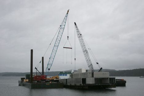 Work started Friday morning to load pieces of the superstructure of the new ferry Chetzemoka onto a barge in Holmes Harbor. Nichols Brothers has wrapped up work on the ferry project