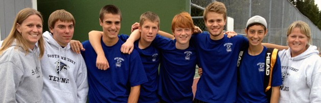 South Whidbey’s boys tennis players celebrate their 1A District 1 team title. From left are assistant coach Nancy Ricketts